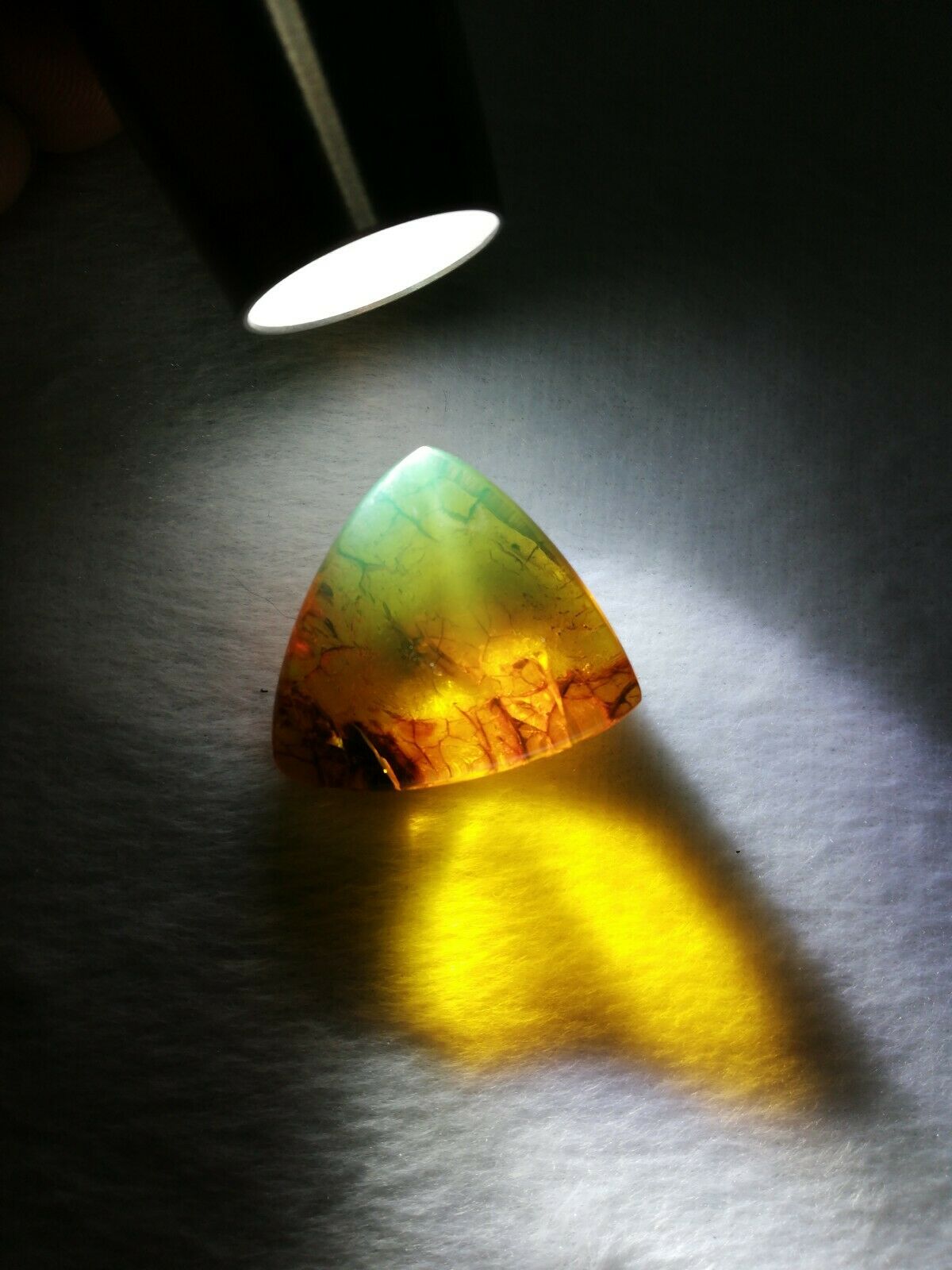 Mexican Amber 5.5g cabochon with natural crust special blue green color