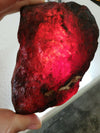 Big and clear Red Mexican Amber 279g with green or blue inside possibly